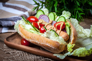 Homemade sandwich on a wooden table.