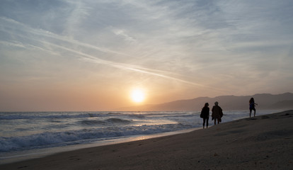 The Pacific ocean during sunset. Landscape with blue sea, the mountains and the dusk sky, the USA, Santa Monica. 