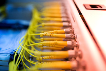 Obraz premium fiber optic with servers in a technology data center