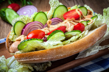 Homemade sandwich on a wooden table.