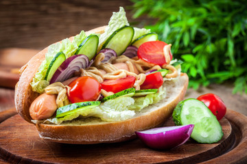 Homemade sandwich on a wooden table.