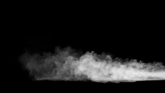 Jet of white smoke billowing across black