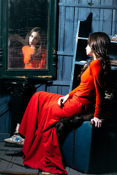 Woman In Red Dress Near Mirror