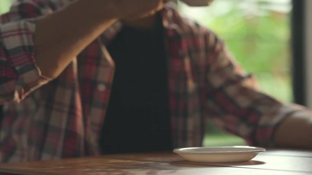 Man reading and drinking coffee