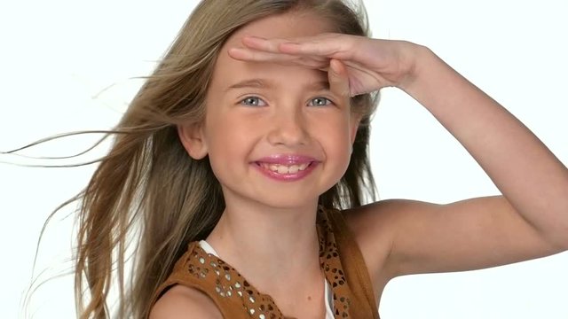 Teenage girl blonde smiling and posing  on white background,slow motion
 