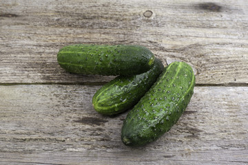 Cucumbers on a wooden background