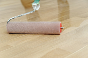 Lacquering wood floors.