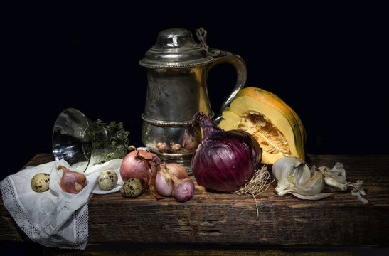 Still life with a silver stein and onions 