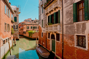 The narrow street - channel in Venice, Italy