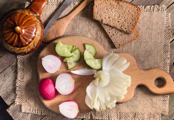 The cut vegetables on an old wooden table