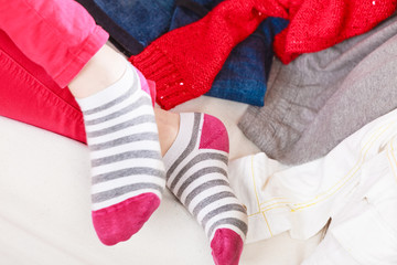 Close up of human woman feet in striped socks.