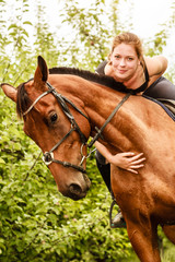 Fototapeta premium Woman jockey training riding horse. Sport activity