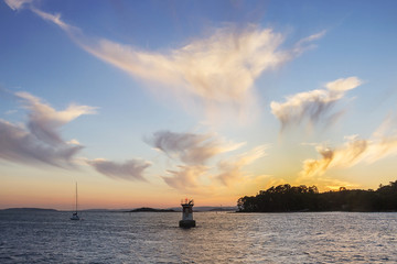 Naklejka na ściany i meble Boat, lighthouse and Cortegada Island