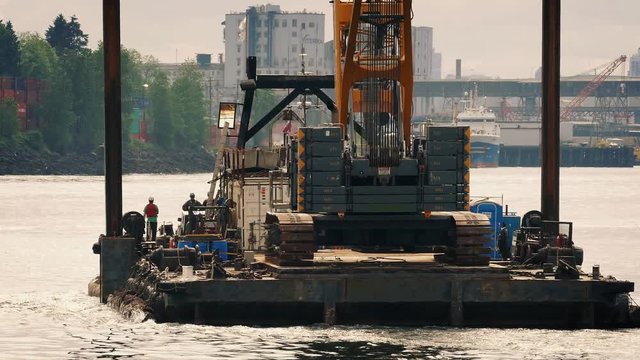 Barge Transporting Crane In City Harbor