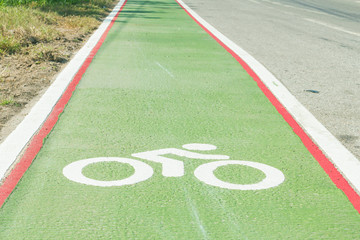 Bicycle path drawn on the asphalt road. Lanes for cyclists. Traffic signs and road safety