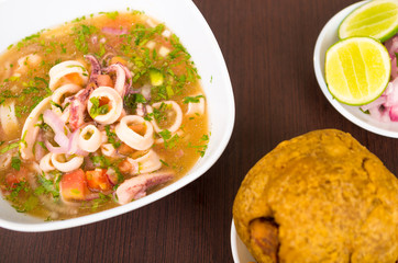Delicious squid and octopus on ceviche, ecuadorian dish with mashed fried banana on side