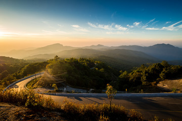 mountain road with sunrise.