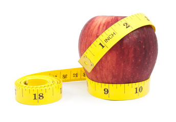 fresh apple with measuring tape isolated over white background