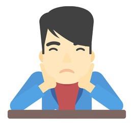 Man clutching his head in desperate.