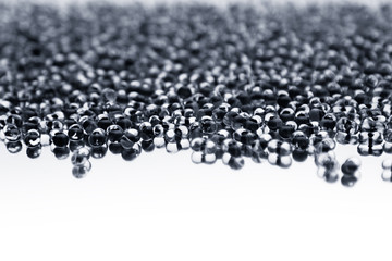 Minimalist abstract light background with transparent glass particles. The texture.