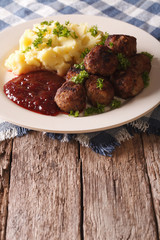 Swedish meatballs kottbullar with a side dish mashed potato closeup. Vertical
