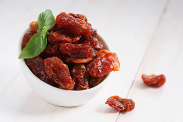 dried tomatoes in white bowl