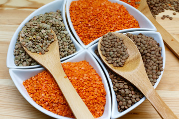 Three kinds of lentil in bowls - red lentil, green lentil and brown lentil