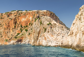 Ancient Alanya fortress on a high rock by the sea