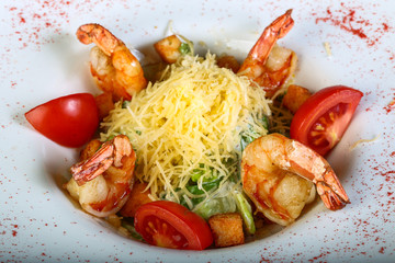 Caesar salad with tiger shrimps