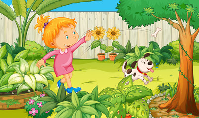 Naklejka premium Girl playing with dog in the garden