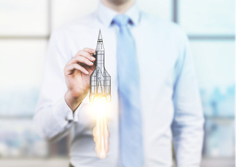 Man holding rocket miniature