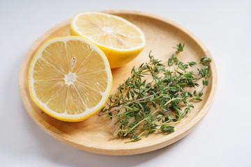 lemon and thyme on white background