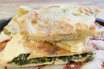 overlapping wedges of home-made pizza