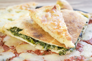 overlapping wedges of home-made pizza