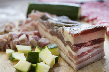 ingredients for sauce pasta: bacon and zucchini