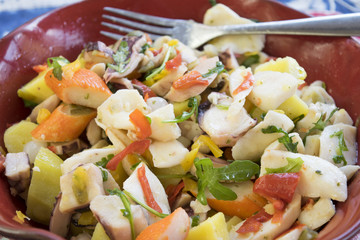sea salad in a red tureen