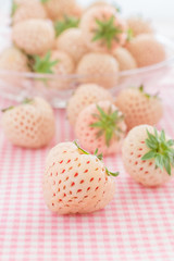 Pineberry or Hula Berry a hybrid strawberry with a pineapple flavor white flesh and red seeds