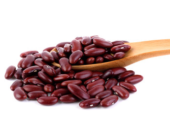 Red beans in spoon on white background