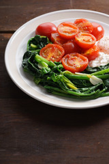tomato and spinach salad with egg.