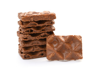 chocolate blocks stack up on a white background