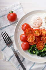 tomato and spinach salad with egg.