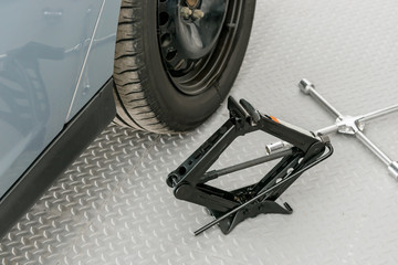 tools for changing wheels close-up in a garage © kosmos111