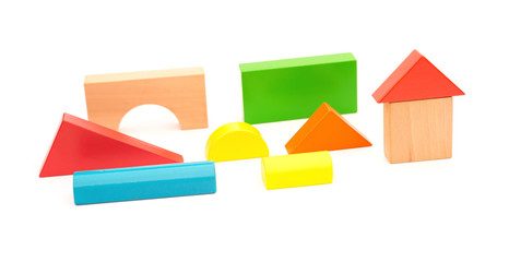 different color and shape wooden toy blocks on white background