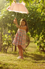 little girl witn pink umbrella