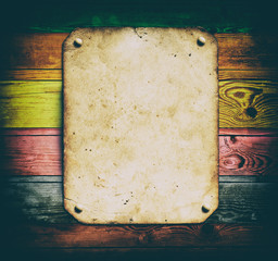 Old paper on the color wood background