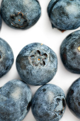 Bilberry or blueberry over white background