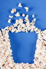 full box of popcorn on blue background