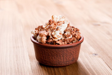 bowl of caramel popcorn on the table