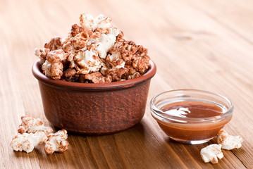 bowl of caramel popcorn on the table