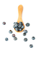 Wooden spoon filled of Bilberry or blueberry over isolated white background